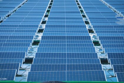 Large floating solar farm array made of blue solar panels and interconnected solar cells.