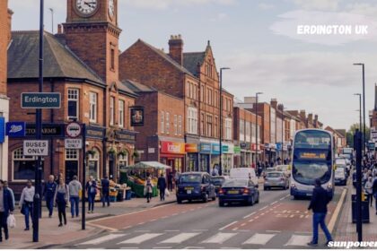 Erdington UK town centre with shops, buses, and busy high street.